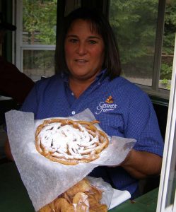 Woman at Grant's Farm serves funnel cake